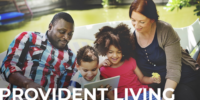 photo of a family relaxing together with a text overlay: Provident Living