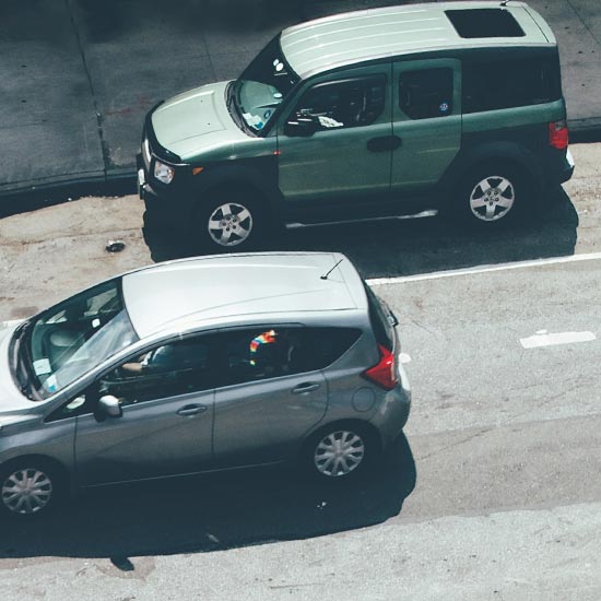 aerial view of cars driving on a city street