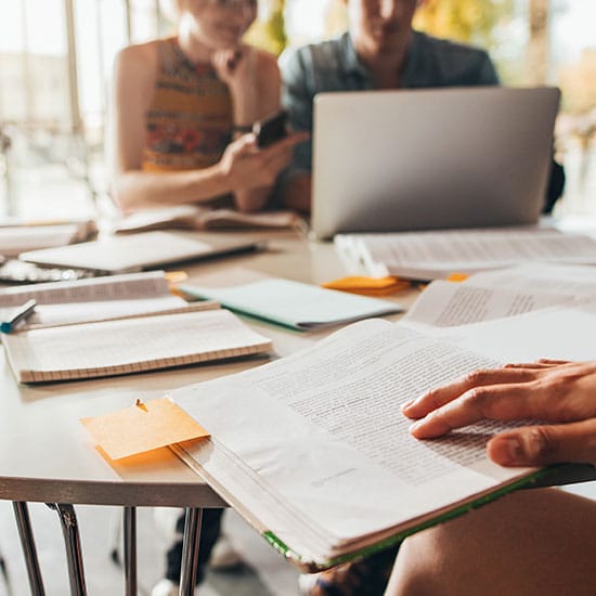 college students studying at a table together