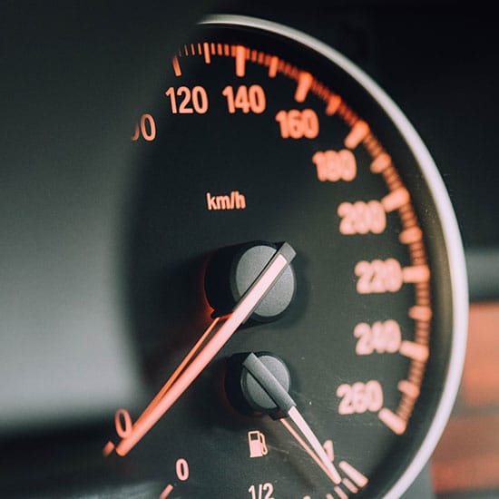 close up of a speedometer on a car's dashboard