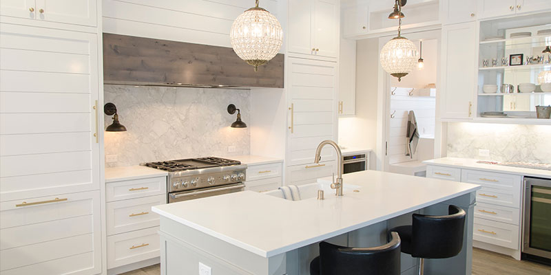 remodeled kitchen with island and barstools