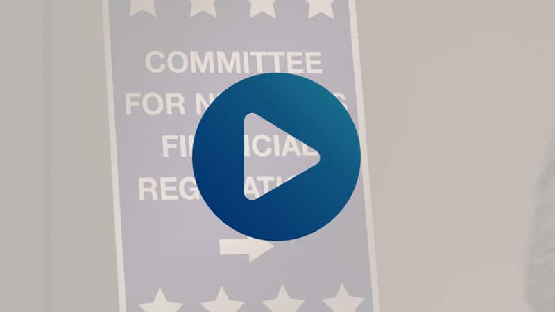 screengrab from CUNA video with play icon overlay; political signage