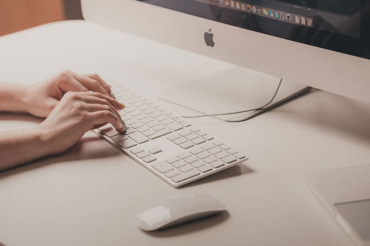 woman typing on a computer