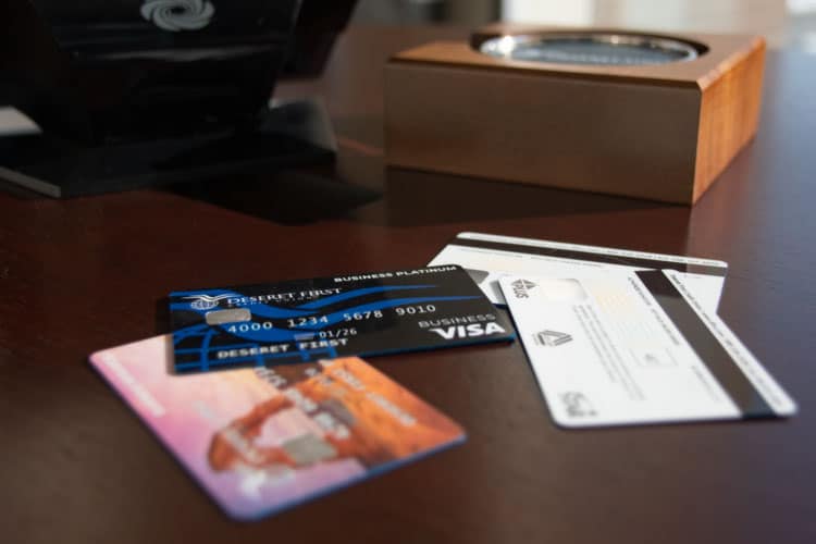 close up of a set of business credit cards laid out on a desk