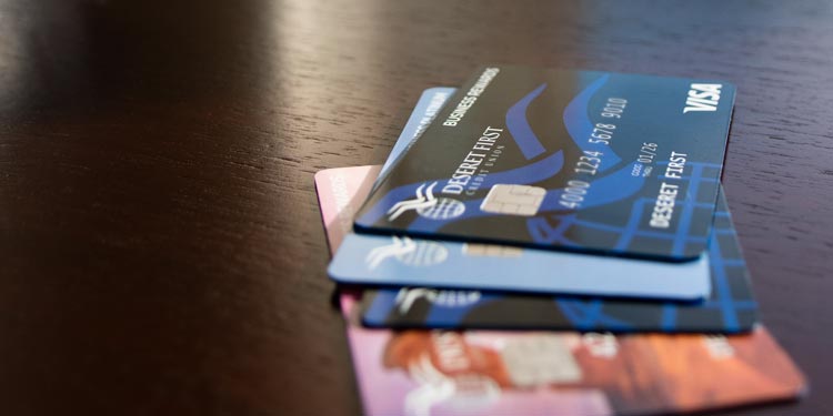 stack of DFCU business cards on table