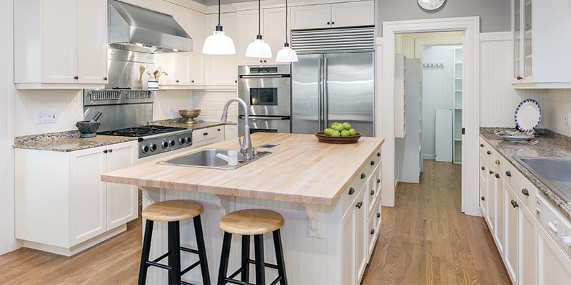 new kitchen with island and stools