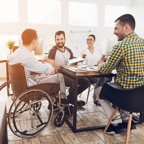 smiling group of casual coworkers meeting together