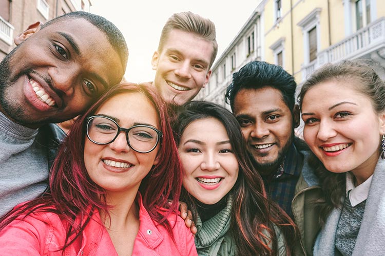 smiling group of college aged friends