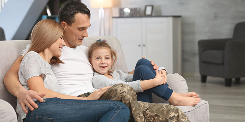 military family relaxing at home