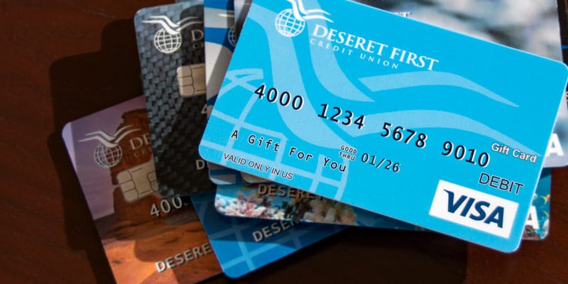 Stack of cards, including a DFCU gift card