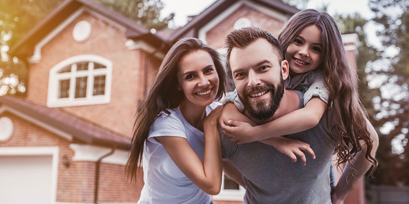 happy family outside their home