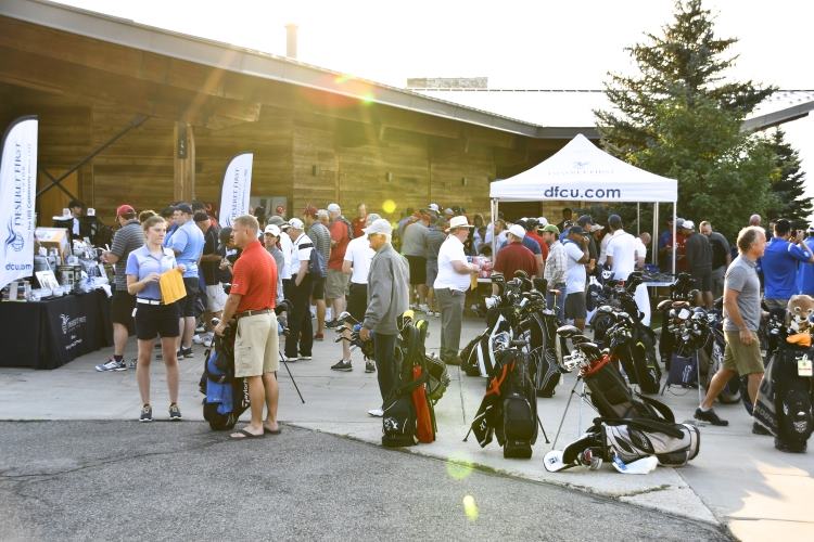 People registering for the golf day and entering the raffle