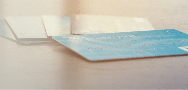 Credit cards laying on table