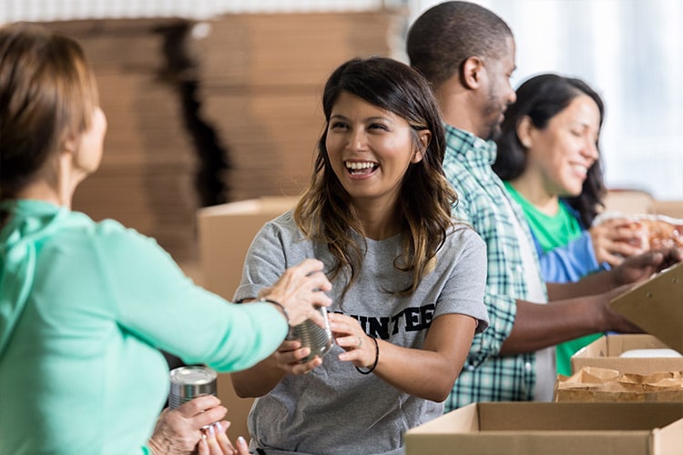 latino woman helping at a food drive