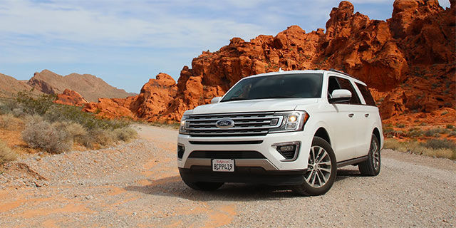 Photo of an SUV in the desert.