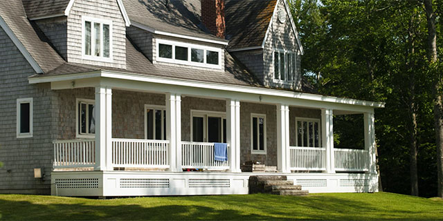 A house with a front porch in the summer