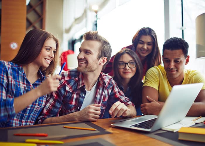 A group of students working together in the library