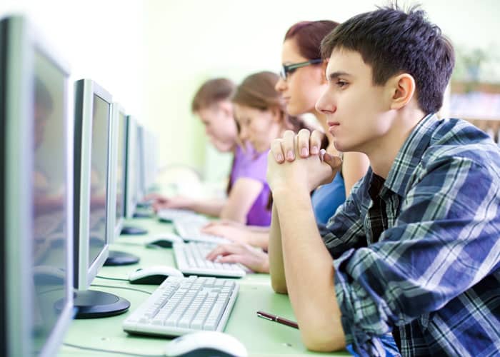 Young students working at computers