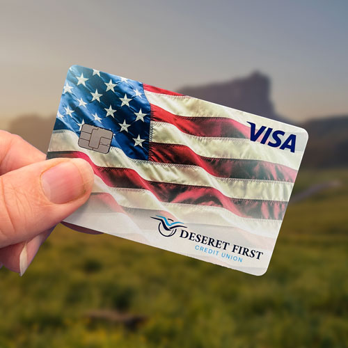 close up of a hand holding a credit card, shallow depth of focus