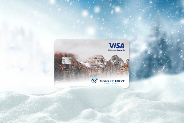 A photo of snow with a Platinum Rewards card on it.