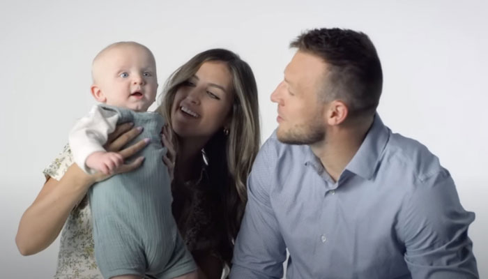 Taysom Hill with his wife and child